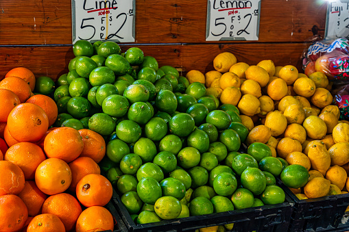The fresh limes, oranges, and lemons at a market stall