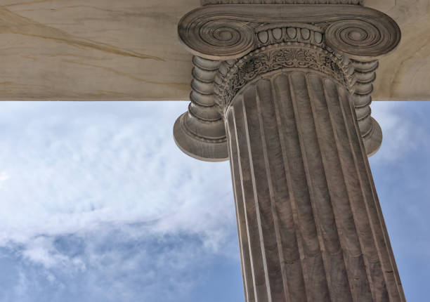 istock greek column pillar detail from ancient greece (museum history archaeology) bank decor ionic curled marble white close up photo blue sky (historic ornate building decor decorated embellishment design) 2040800162