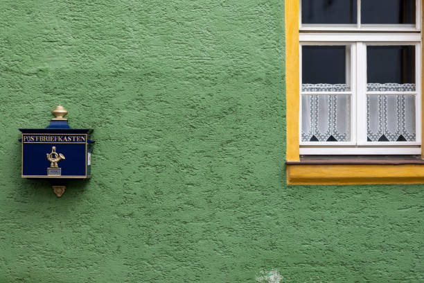 Straubing, Germany - Feb 18th 2024: A retro style mail box creates a nice ambience in Straubing Old Town.