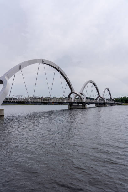 istock Arched bridge over water under a cloudy sky, Sweden, Soelvesborg 2040856659