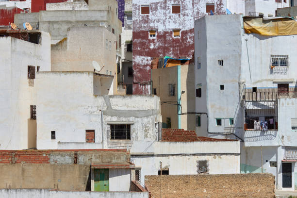 Diving photo of the popular and dense Jbel Dersa neighborhood in Tetouan, with its houses tightly packed together, forming a smooth weave of red terracotta bricks.