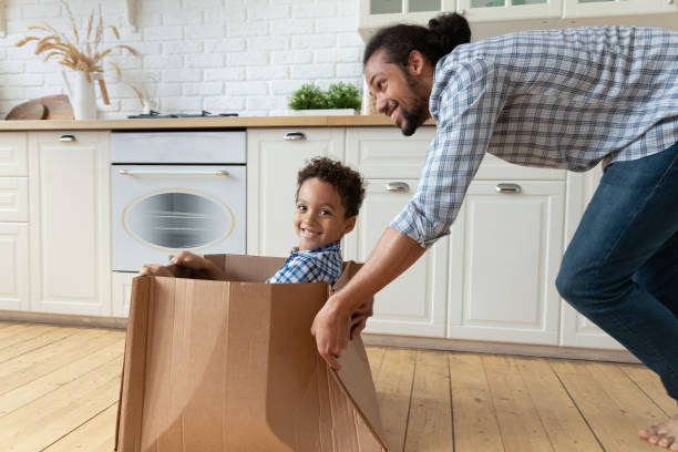 istock Happy small kid boy playing with African father. 2040883193