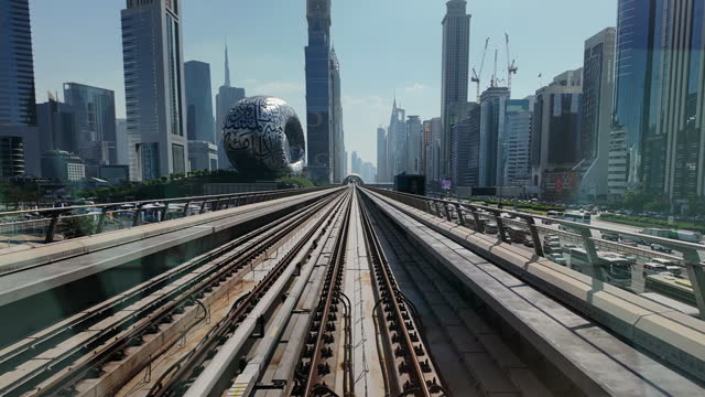 POV Shot from Modern Dubai Metro Train Running Alongside Sheikh Zayed Road in Dubai, United Arab Emirates (UAE)