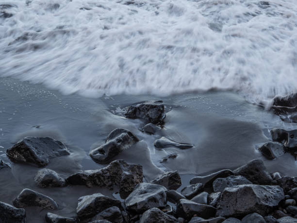 istock beach with black volcanic sand on  Tenerife 2040918306