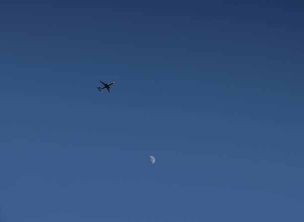 Free Stock Photo of Plane Flying Through Cloudy Sky With Moon in ...