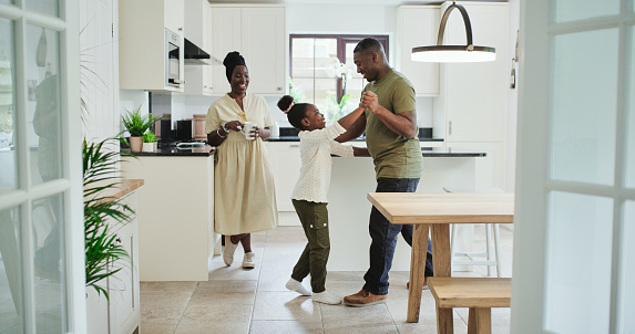 Kitchen, dancing and black family child, father and papa practice performance, teaching ballet or bond. Dancer, love and happy man, dad and kid girl learning routine steps, movement or performance