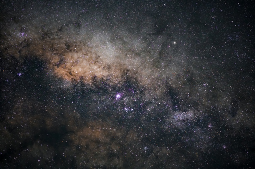 Night sky with numerous stars and clouds