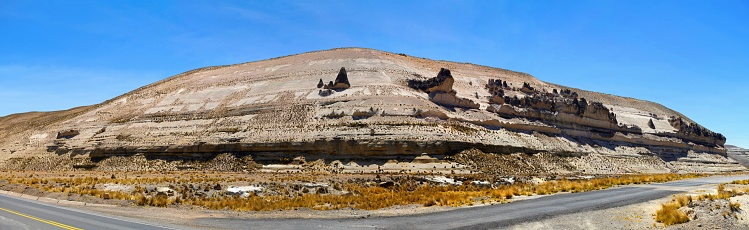 Patahuasi, Peru, November 6, 2021: Panoramic view of a wide rock formation in the locality Patahuasi at an altitude of 4000 meters on a sunny day.