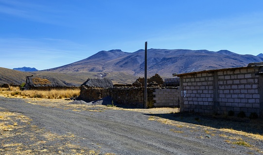 Pampa de Arrieros, Peru, November 6, 2021: View of abandoned ruined houses in this Peruvian village at an altitude of 4000 metres. The Andean village is called ghost town(pueblo de famtasma) today.