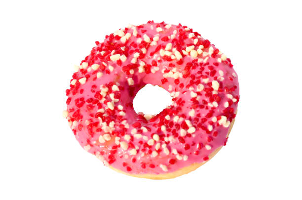 Close up of a pink donut with sprinkles. Macro