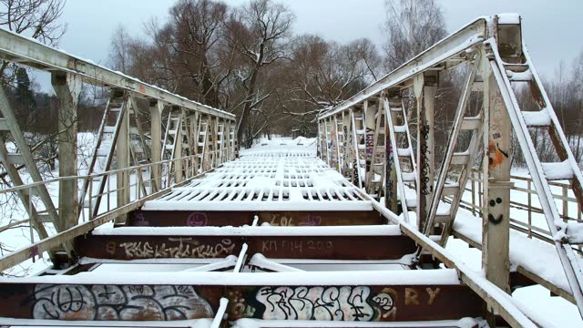 Small Bridge Over Frozen River Drone Footage