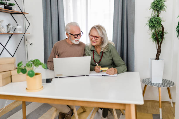 istock Senior couple shopping at home 2040952243