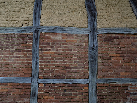 old timber framing  brick wall
