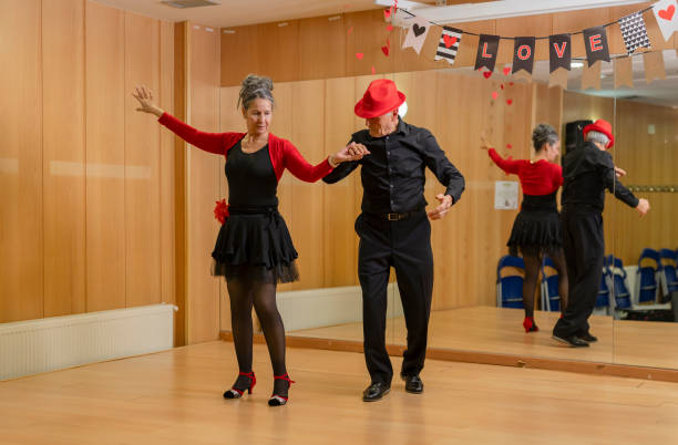 istock elderly couple giving ballroom dance classes at dance school for retirees 2040958556
