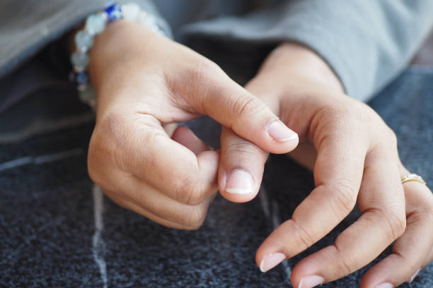 istock Young women hands suffering thumb finger pain 2040960627