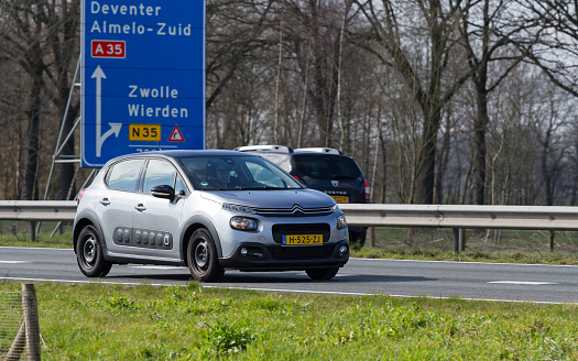 Netherlands, Overijssel, Twente, Wierden, March 19th 2023, side/front view close-up of a 2020 Dutch gray Citroën 3rd generation C3 car driving on the N36 at Wierden, the C3 has been made by French manufacturer Citroën since 2002, the N36 is a 36 kilometer long highway from Wierden to Ommen