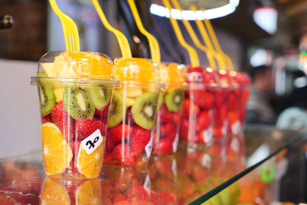 istock pineapple, kiwi and Strawberries in. plastic container selling at shop 2040973185