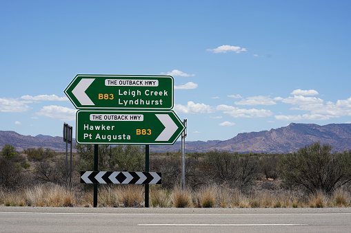 Directional road sign along the Outback Highway. Shows direction to Leigh Creek, Lyndhurst, Hawker, and Port Augusta