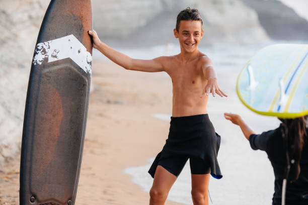 istock Teenagers ready to go surfing 2040987051