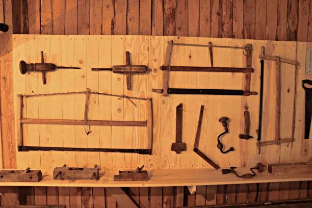 There are many different joinery tools from the last century on the stand in the workshop.