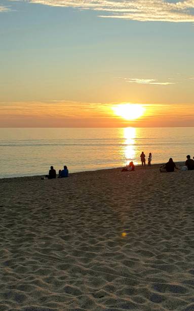 istock Couples Watching the Sunset at the Beach 2041000867