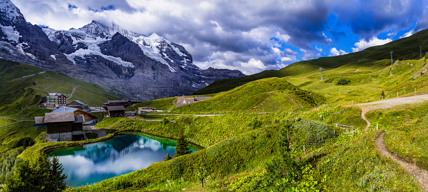amazing Swiss nature . Kleine Scheidegg mountain pass that runs between the famous Eiger and the Lauberhorn famous for hiking in Bernese Alps. Switzerland travel