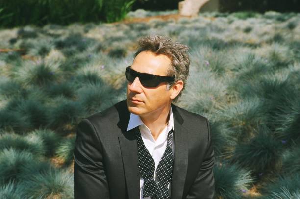 istock Handsome Man in Sunglasses and Business Suit Looks Aside 2041013341