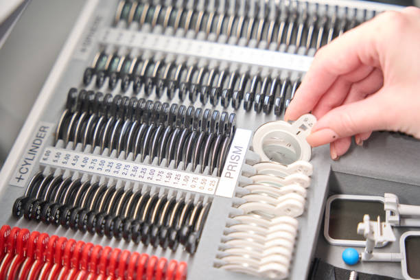 Female takes out a numbered lens from the organizer, the lenses are in the cells
