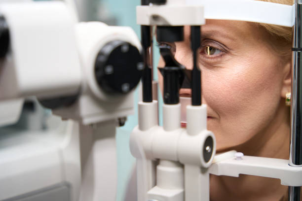 istock Woman head is fixed in front of special ophthalmological device 2041017641