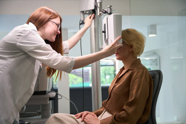 istock Red-haired doctor uses modern equipment in her work 2041017650