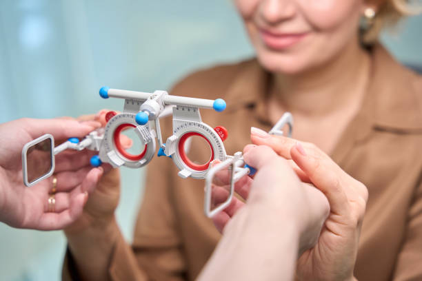 istock Employee of an optical salon uses professional device at work 2041017657