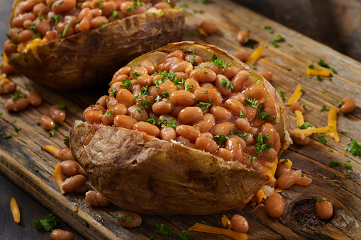 Jacket Potatoes with Butter, Cheddar Cheese and Baked Beans in Tomato Sauce