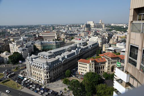 Bucharest skyline seen from a tall building in the center of the town. The image was captured during summer season.