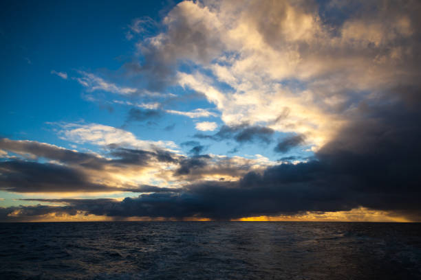 istock Rays of light at sunset in the ocean. Sunset sky. 2041047907