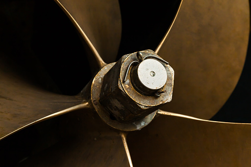Ship's bronze propeller, close-up. Ship propeller blades.