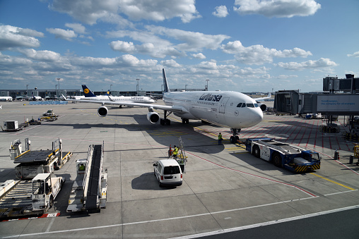 Frankfurt Airport with a large commercial airplane. The image was captured during summer season.