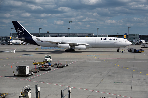 Frankfurt Airport with a large commercial airplane. The image was captured during summer season.