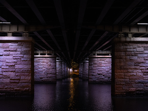 Under a bridge at night with under bridge lighting