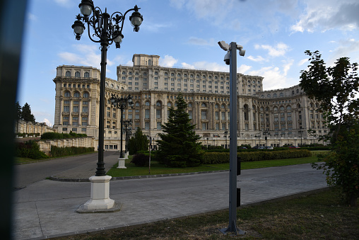 The Palace of the Parliament is the seat of the Parliament of Romania. The Palace of the Parliament is one of the heaviest buildings in the world, constructed over a period of 13 years (1984–1997). The image shows the building exterior, captured during summer season.