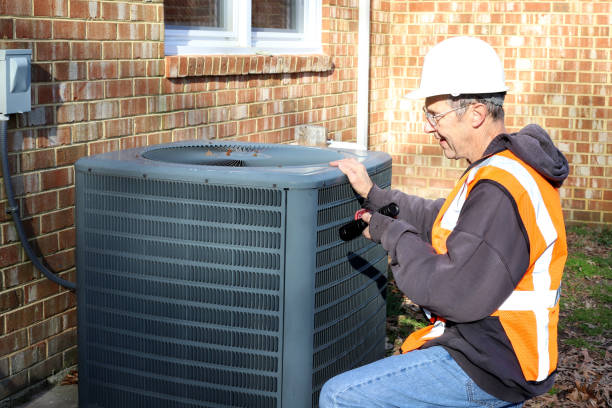 istock Home inspection of central air unit by a maintenance worker 2041086967