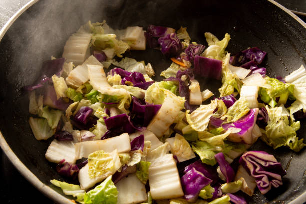 istock Steamed vegetables in a skillet pan in close up 2041102110