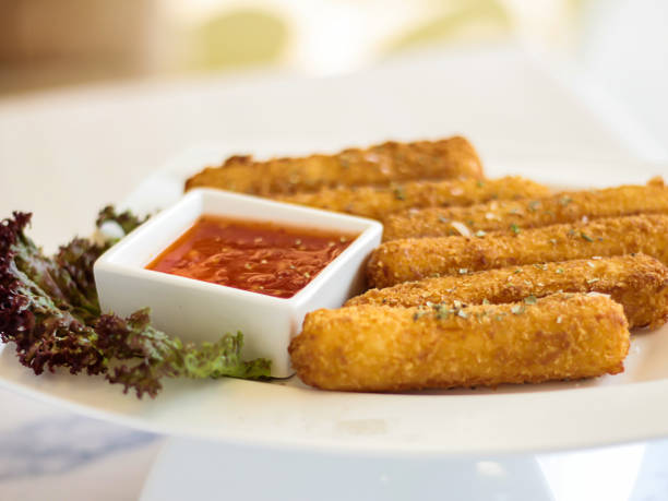 istock Cheese Fingers sticks with chilli sauce served in dish isolated on table side view of arabic fastfood 2041129593