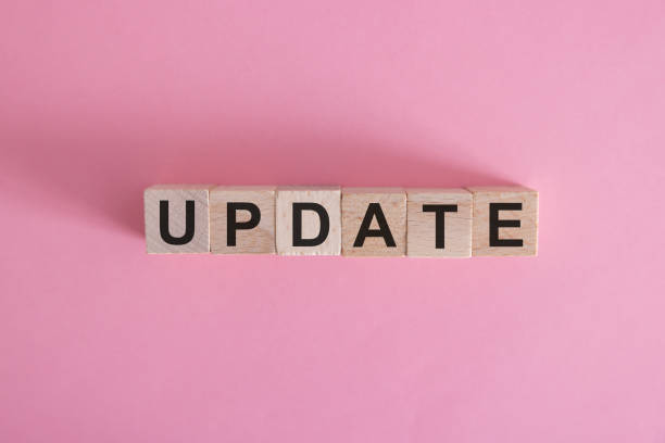 istock Text UPDATE on wooden cubes on blue background. Square wood blocks. Top view, flat lay. 2041137385