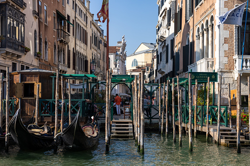 Venice, Italy - September 5, 2022: Moored gondolas on the Grand Canal in Venice, Italy