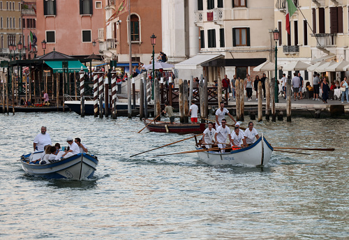 Venice, Italy - September 4, 2022: Local rowing team training on the Grand Canal in Venice, Italy