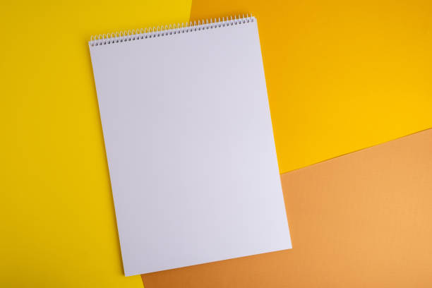 istock Spiral notepad on a colored background. School supplies. Place for text 2041143166