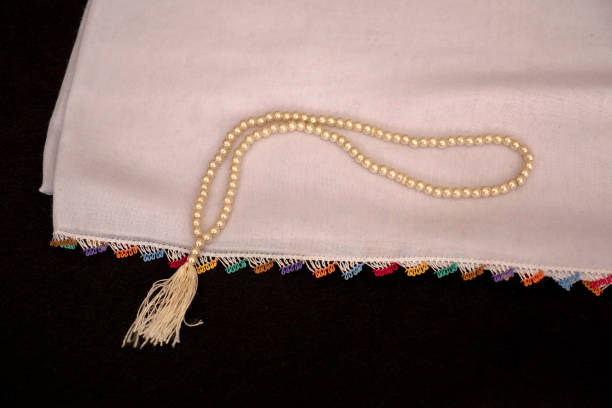 hand-knitted patterned headscarf used during prayer and a rosary,