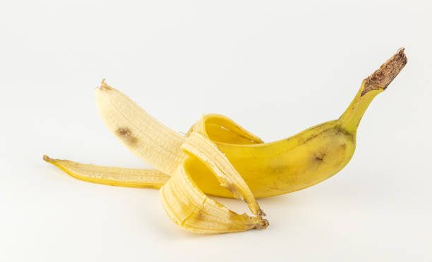 istock Half a peeled banana. Yellow banana. 2041169672