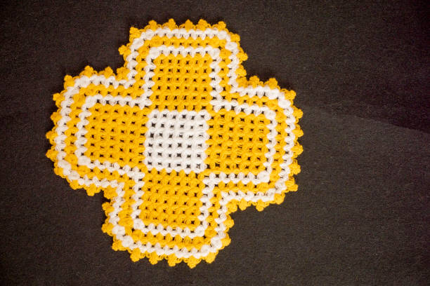 Christian cross, Holy Week of Lent, on a soffa mesh background with red heart end copy space.