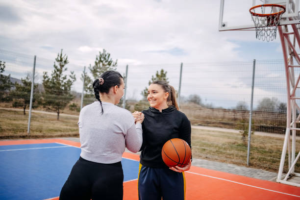 istock Female friends playing one on one basketball 2041192527
